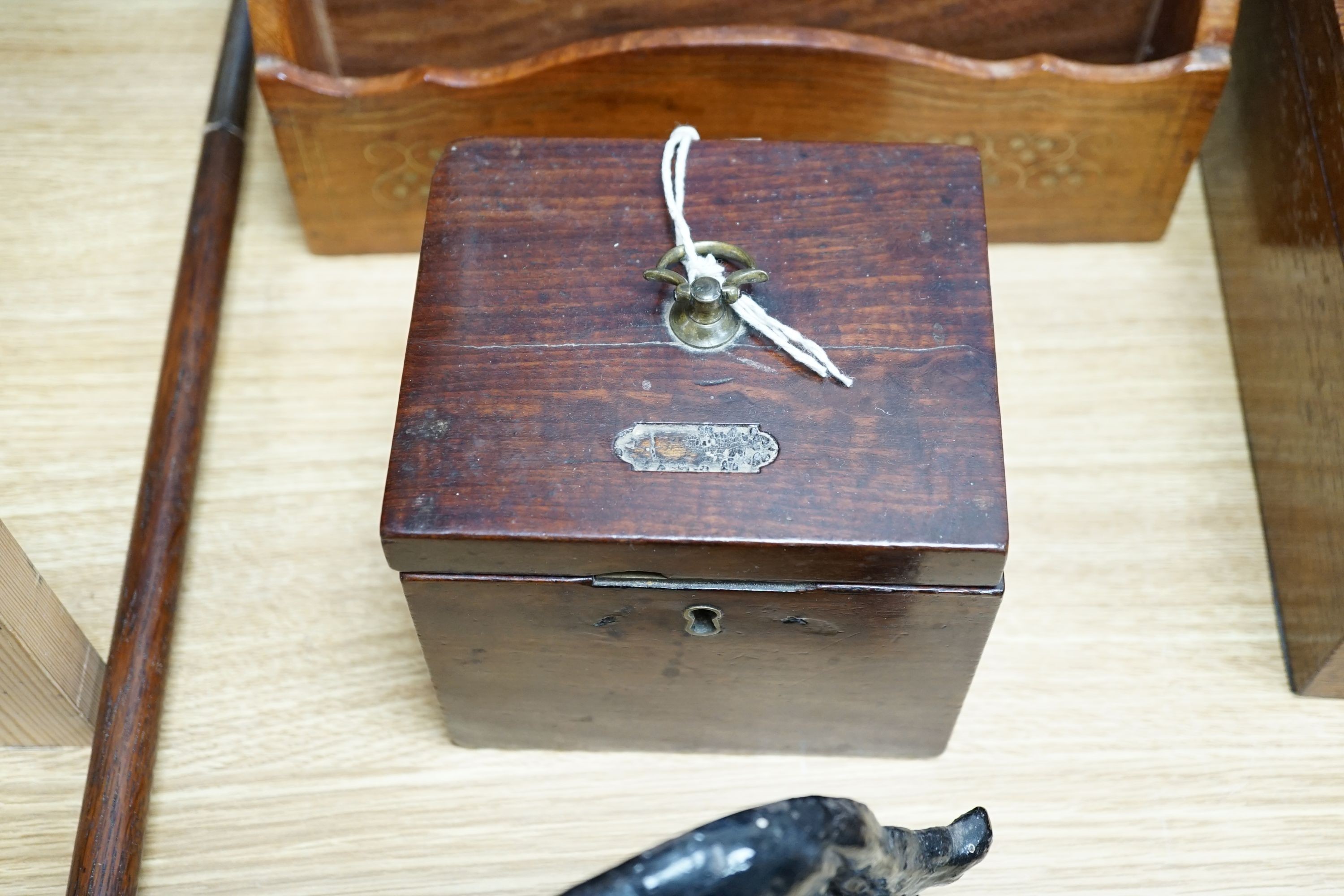 A Georgian square mahogany tea caddy, a brass inlaid hardwood stationary rack and box, and sundry items